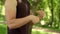 Man doing fitness exercise outdoor. Close up of fitness man stretching wrist