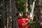 Man doing mans job. Agriculture and forestry theme. Handsome young man with axe near forest. The Lumberjack working in a