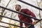 Man doing pullups in a street workout park