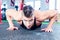 Man doing push-up in sport fitness gym