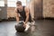 Man doing push ups on medicine ball