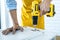 Man doing renovation work at home drilling wood with drill tack on locker