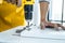 Man doing renovation work at home drilling wood with drill tack on locker