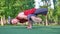 Man doing stunt trick on basketball field