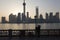 Man doing Tai Chi exercises on the Bund at dawn Shanghai