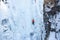 Man doing a vertical ice climb