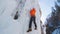 Man doing a vertical ice climb