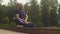 A man doing yoga exercises in the park