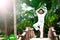 Man doing yoga in tropic jungle bridge