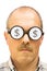 Man with dollar signs on his glasses