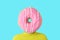 A man with a donut instead of head. Minimal summer concept