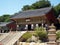 A man at the door of one of the Beomeosa temples, Busan, Korea