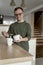 Man with down syndrome preparing morning coffee to themselves