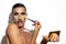 Man with drag queen makeup on white background