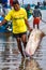 Man drags freshly caught flounder on beach