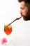 Man drink cocktail from glass. bearded man drinkiing cocktail with straw isolated on white. summer refresh. alcoholic