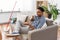 Man drinking coffee, resting after home cleaning