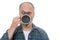 Man drinking from mug and looking over