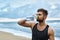 Man Drinking Refreshing Water After Workout At Beach. Drink