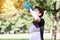 Man drinking water from bottle after worker in the park. Men raising bottles drink water to refresh after exercise at