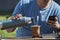 Man drinking Yerba mate while looking at his cell phone