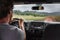 Man driver driving off road trail path with 4x4 car on adventure trip travel holiday. Hawaii drive in the rain