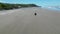 Man driving around a beach with an ATV in El Salvador during summertime