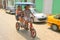 Man driving bicycle taxi