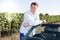 man driving with blue convertible car smiling and happiness