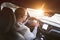 Man driving a car. Success in motion. Handsome young man driving a car. A man holds the steering wheel of a car