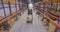 Man driving forklift truck in warehouse
