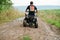 Man driving four-wheller ATV quad bike