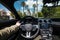 Man driving luxury car in Beverly Hills, California at hot summer day. Luxury lifestyle concept