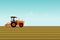 The man is driving a orange tractor. In order to plow the soil in the field.