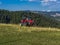 A man driving a quad ATV motorcycle through beautiful meadow landscapes