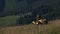 Man driving quad bike in summer mountain.