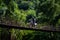 Man driving riding over old bridge in Guatemalan Mountains