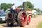 Man driving steam engine.