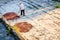 Man drying cacao beans in Guatemala