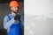 man drywall worker installing plasterboard sheet to wall