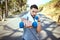 Man, dumbbell and punch in nature fitness for exercise, workout or training in the outdoors. Portrait of fit, active and