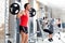 Man with dumbbell weight training equipment gym