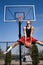 Man Dunking a Basketball