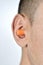 Man with an earplug in his ear