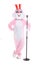 Man in a easter bunny costume with retro microphone, sings, have fun on white background. Funny hare or rabbit singer