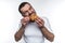 Man eating croissan. He is biting it hard. He likes this french dessert. Isolated on white background.