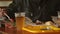 Man eating in fast food, drinking beer, plastic fork, burgers