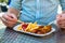 Man eating German Currywurst