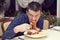 Man eating a large portion of pasta