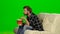 Man eating popcorn and watching a movie. Green screen